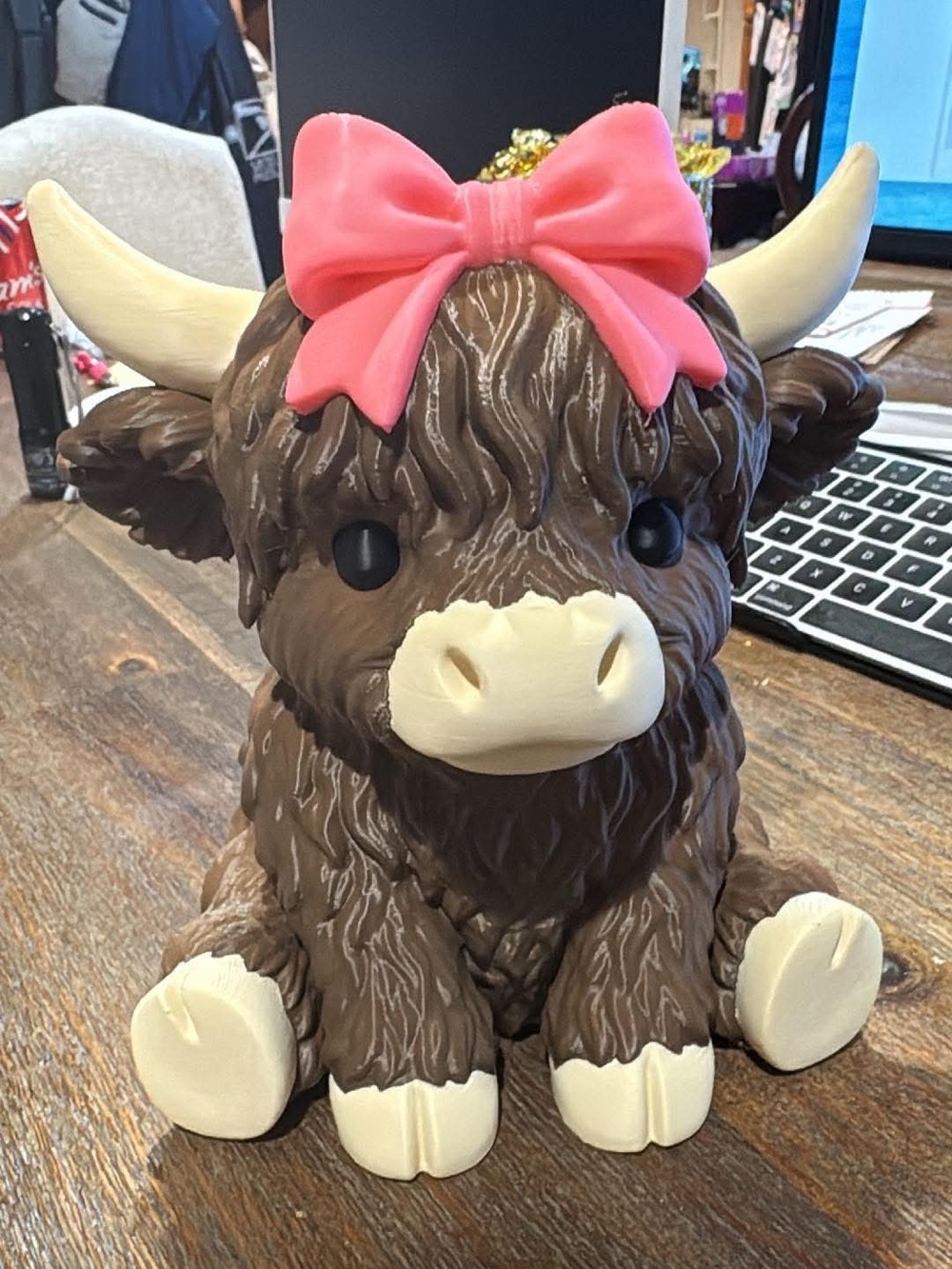 Brown Highland Cow Figurine with Pink Bow Decorative Accent